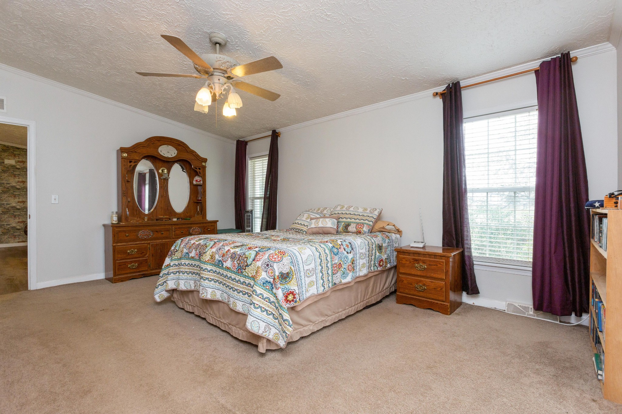 5425 Ashburn Road Springfield, TN 37172 - Photo 31 of 40 a bed sitting in a spacious bedroom next to a window