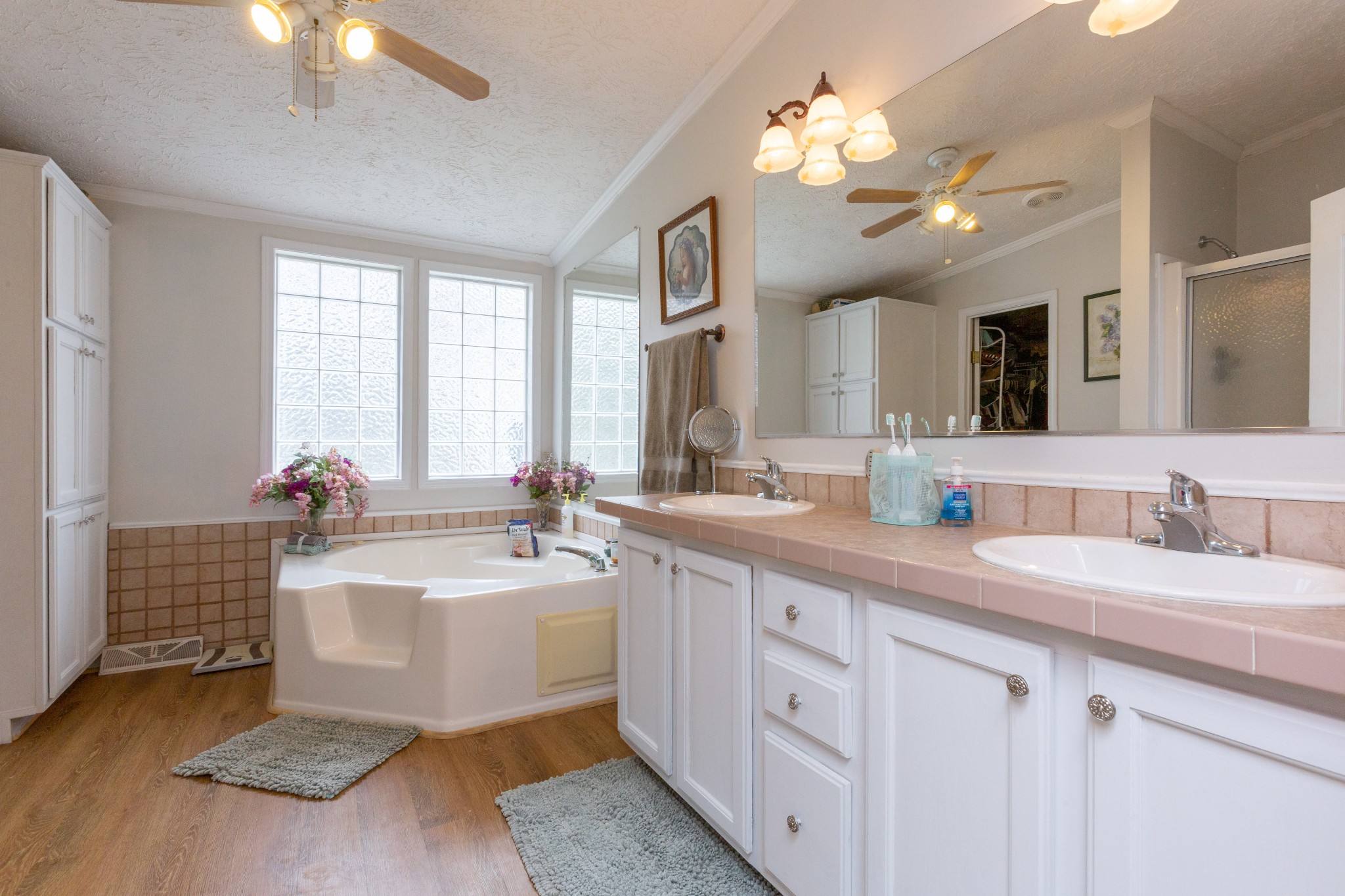 5425 Ashburn Road Springfield, TN 37172 - Photo 32 of 40 a spacious en suite bathroom with a double vanity sink large mirror and a chandelier