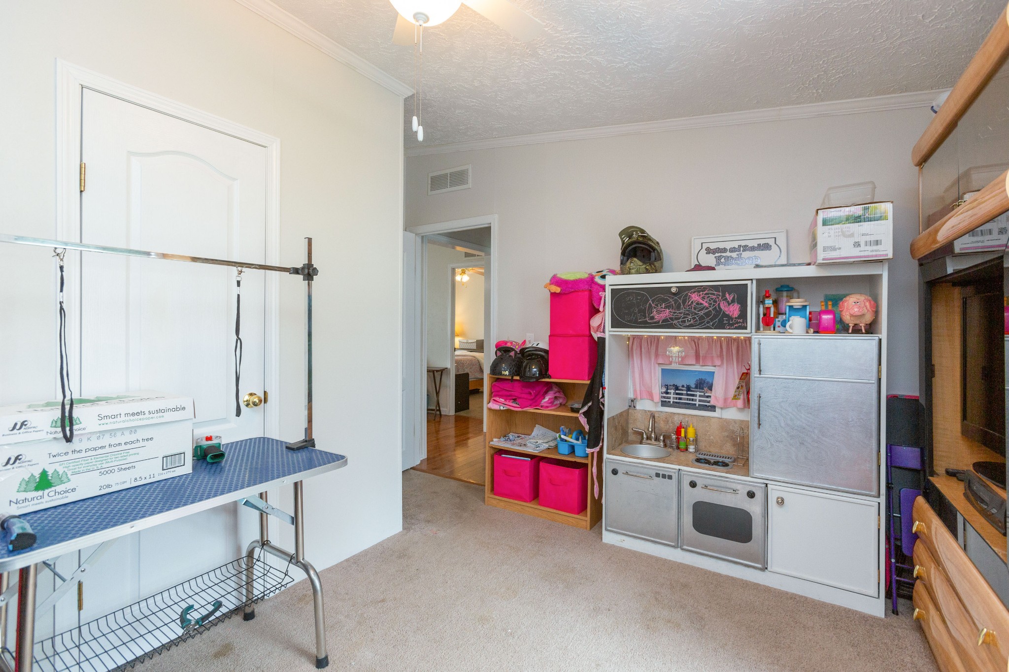 5425 Ashburn Road Springfield, TN 37172 - Photo 34 of 40 a room with furniture a flat screen tv and a book shelf