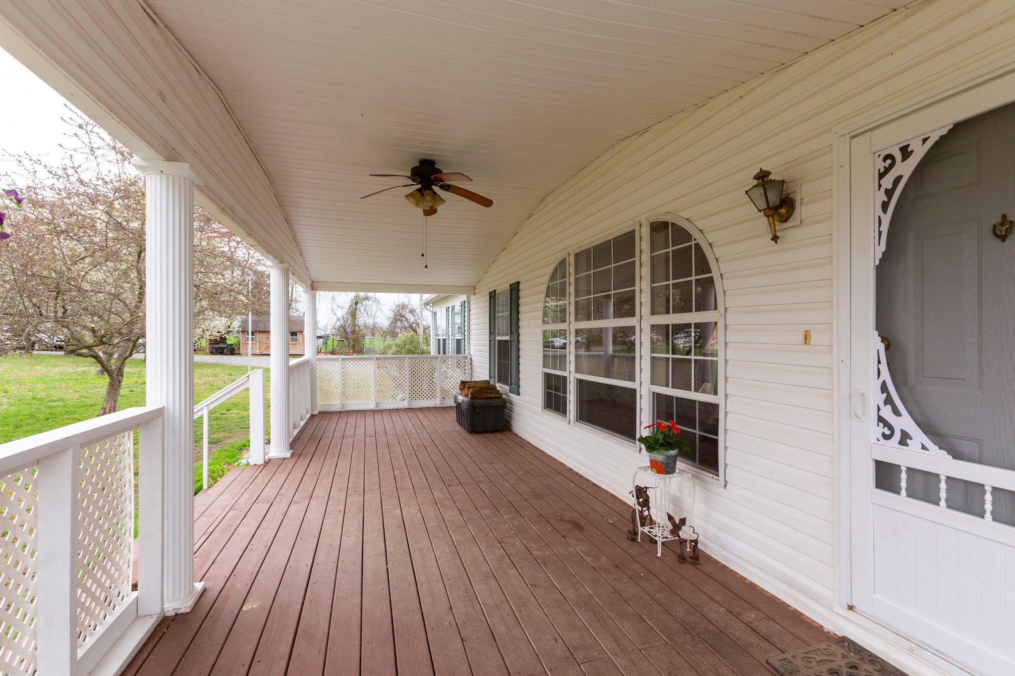 5425 Ashburn Road Springfield, TN 37172 - Photo 8 of 40 a view of a porch with wooden floor and iron stairs