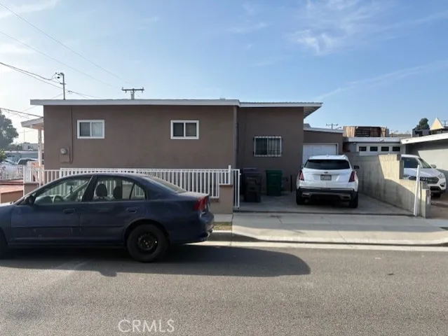 a view of a car parked in front of a house