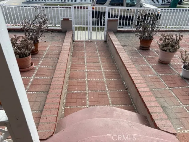 a view of a porch with wooden floor
