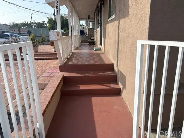 a view of staircase with white walls