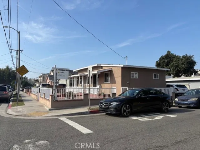 a view of a car parked in front of a house