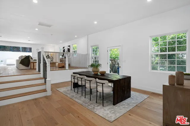 a outdoor space with patio the couches and a dining table with garden view