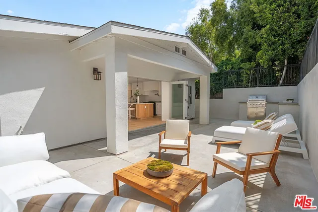 a en suite bathroom with a sink mirror and toilet