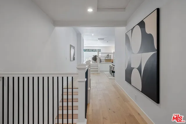 a bedroom with a large bed and a couch