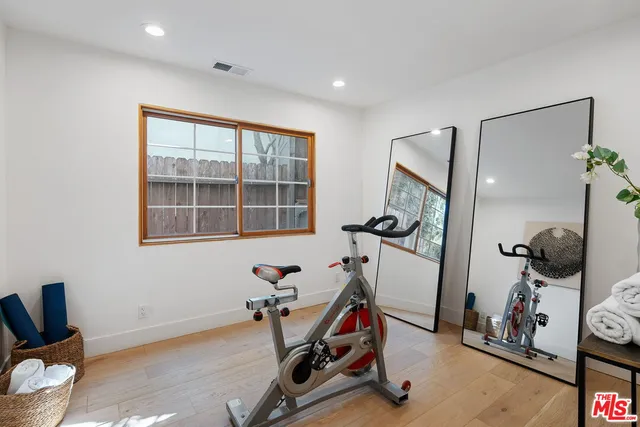 a backyard of a house with outdoor seating