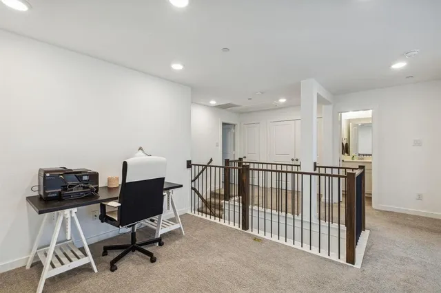 a kitchen with stainless steel appliances kitchen island granite countertop a stove and a sink