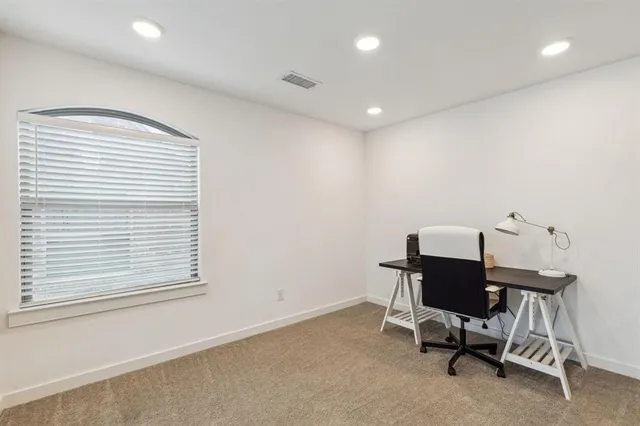 a view of a workspace with furniture