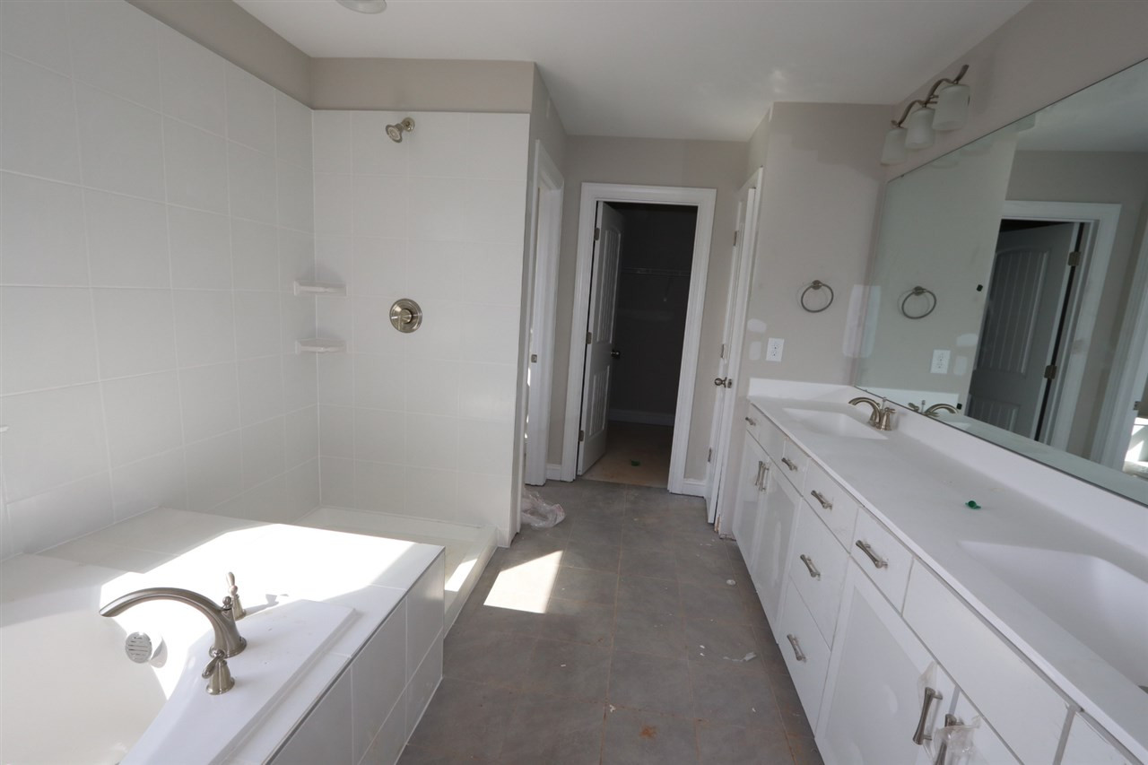 7224 Rex Road Holly Springs, NC 27540 - Photo 9 of 30 Model home shown for illustrative purposes Master Bath/Spa