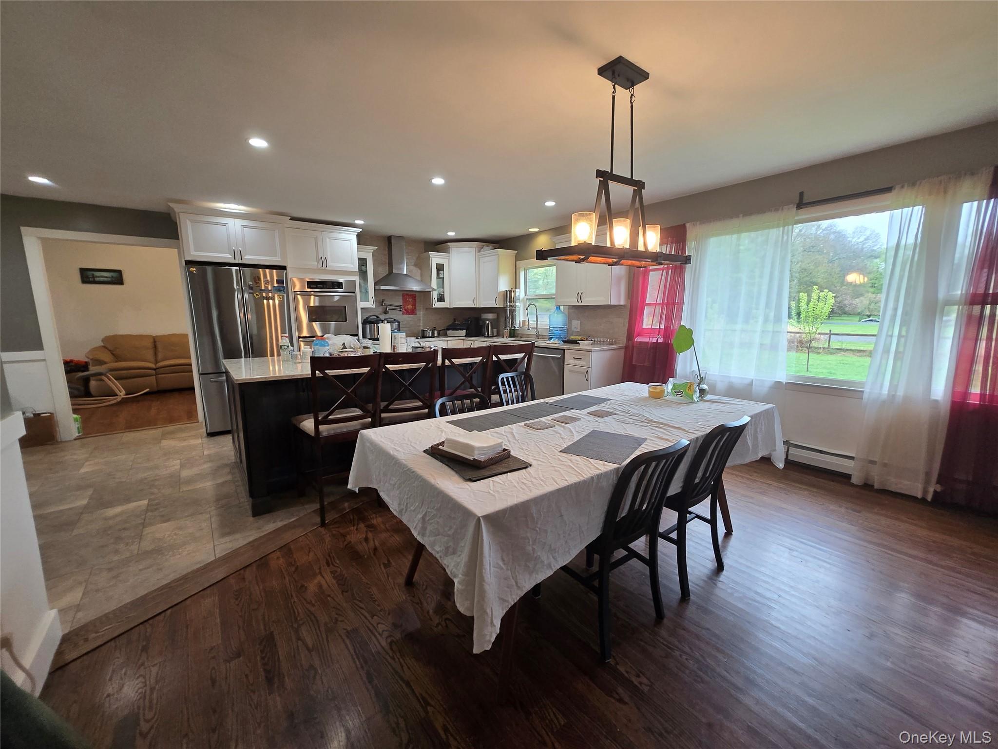 234 Sinsabaugh Road Pine Bush, NY 12566 - Photo 11 of 15 a view of a dining room with furniture window and wooden floor