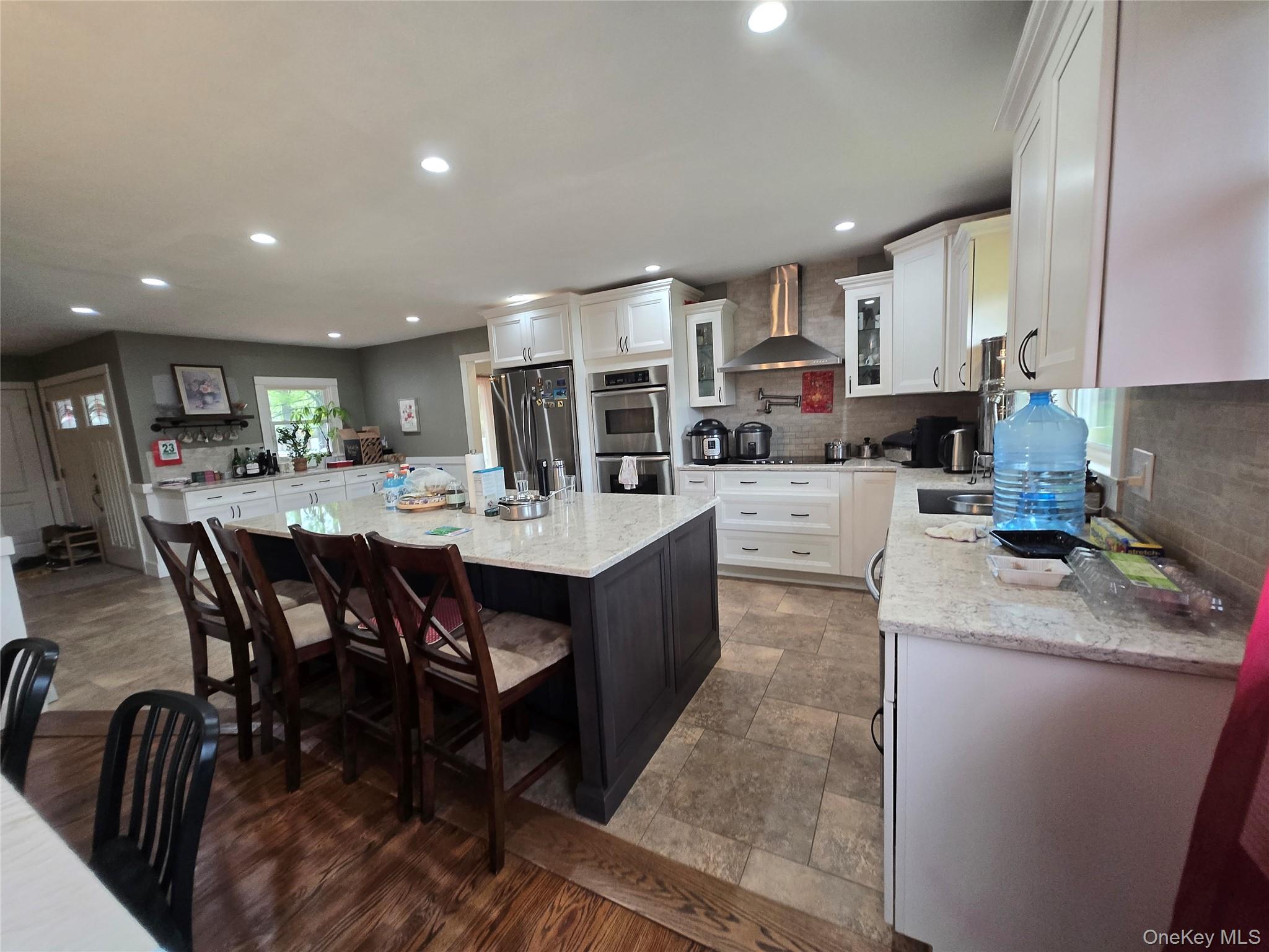 234 Sinsabaugh Road Pine Bush, NY 12566 - Photo 13 of 15 a kitchen with a dining table chairs and wooden floor