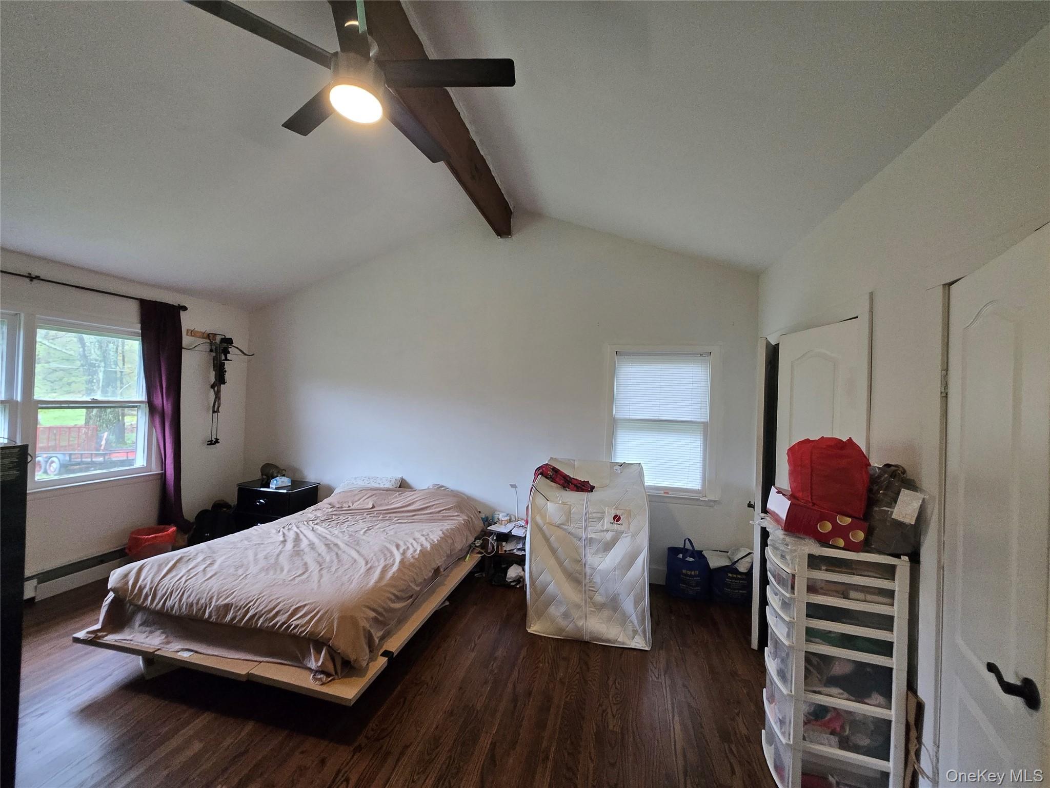 234 Sinsabaugh Road Pine Bush, NY 12566 - Photo 5 of 15 a bedroom with a bed and wooden floor