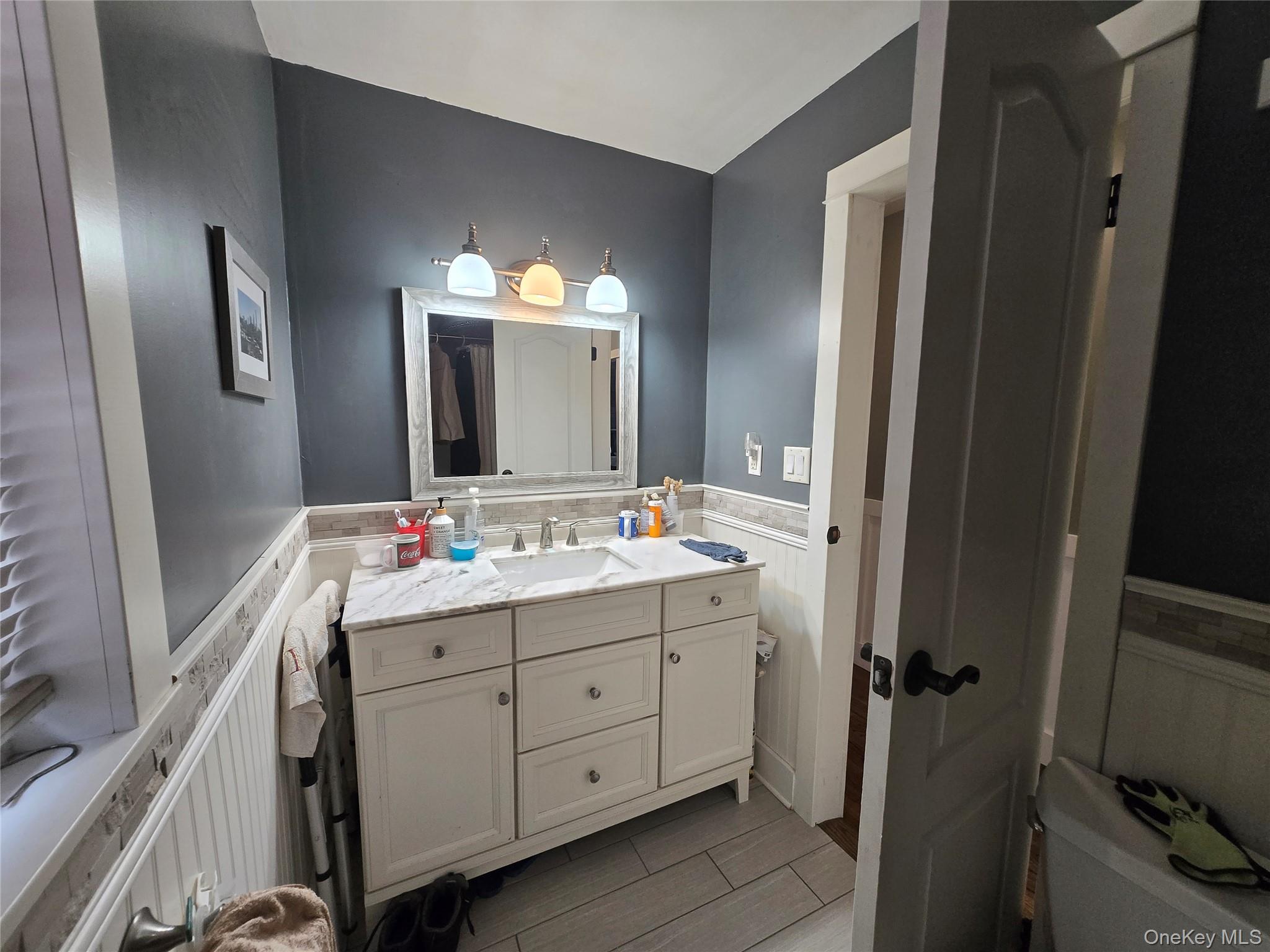 234 Sinsabaugh Road Pine Bush, NY 12566 - Photo 9 of 15 a bathroom with a double vanity sink and a mirror