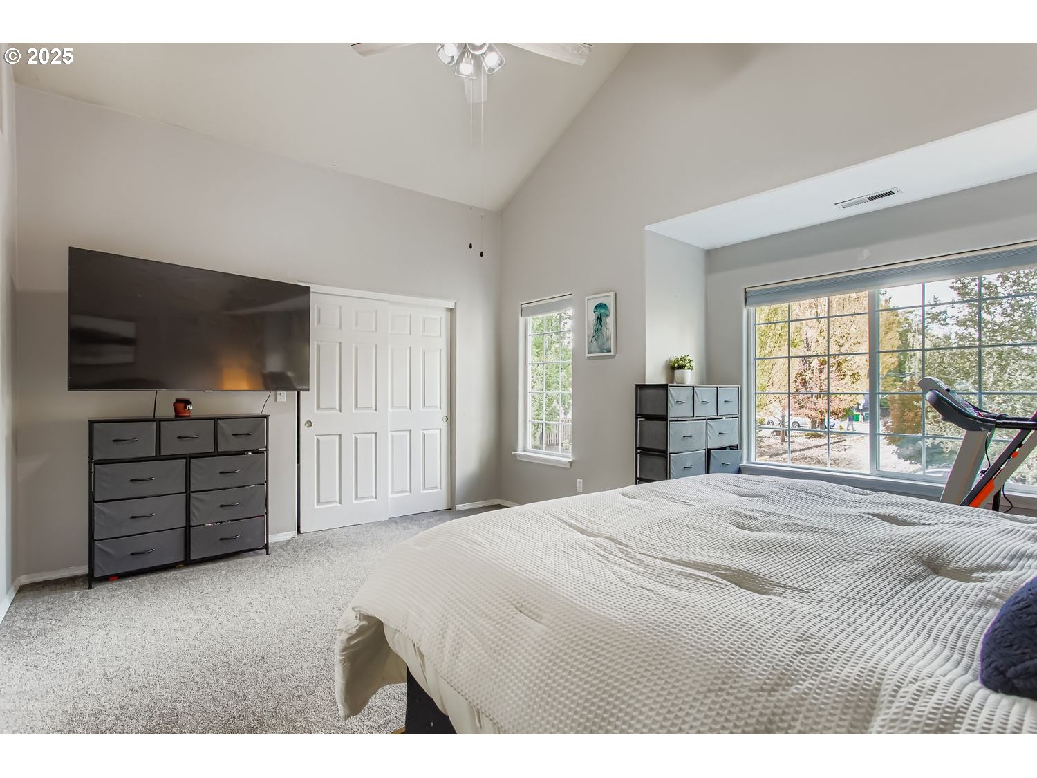 3138 Southwest 177th Place Beaverton, OR 97003 - Photo 13 of 28 a bedroom with a bed and a flat screen tv