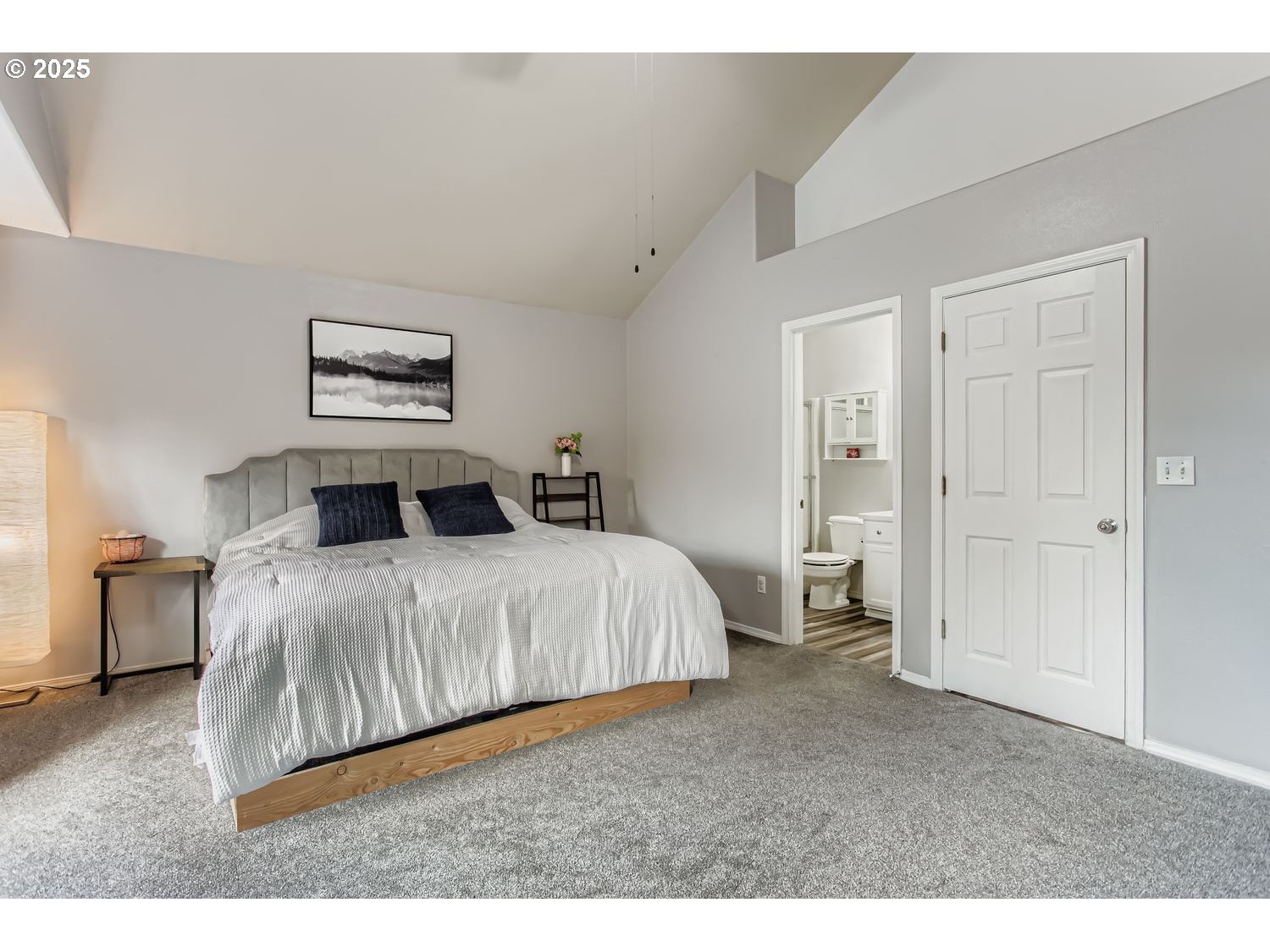 3138 Southwest 177th Place Beaverton, OR 97003 - Photo 14 of 28 a bedroom with a bed and a painting on the wall