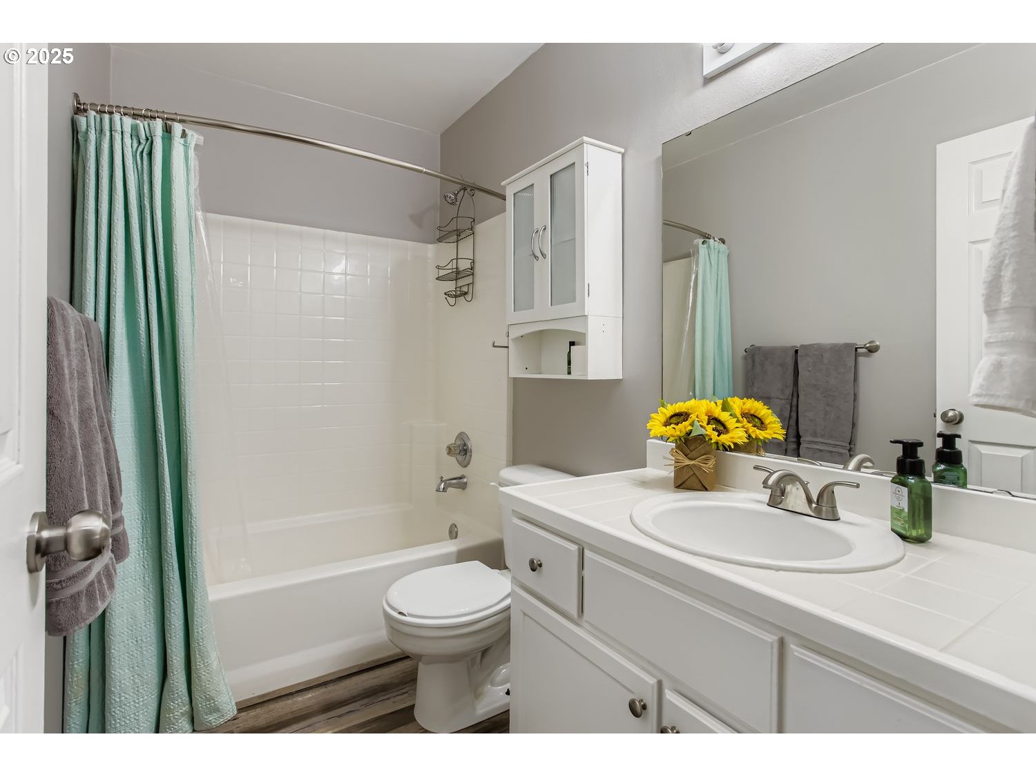 3138 Southwest 177th Place Beaverton, OR 97003 - Photo 20 of 28 a bathroom with a sink a toilet and shower
