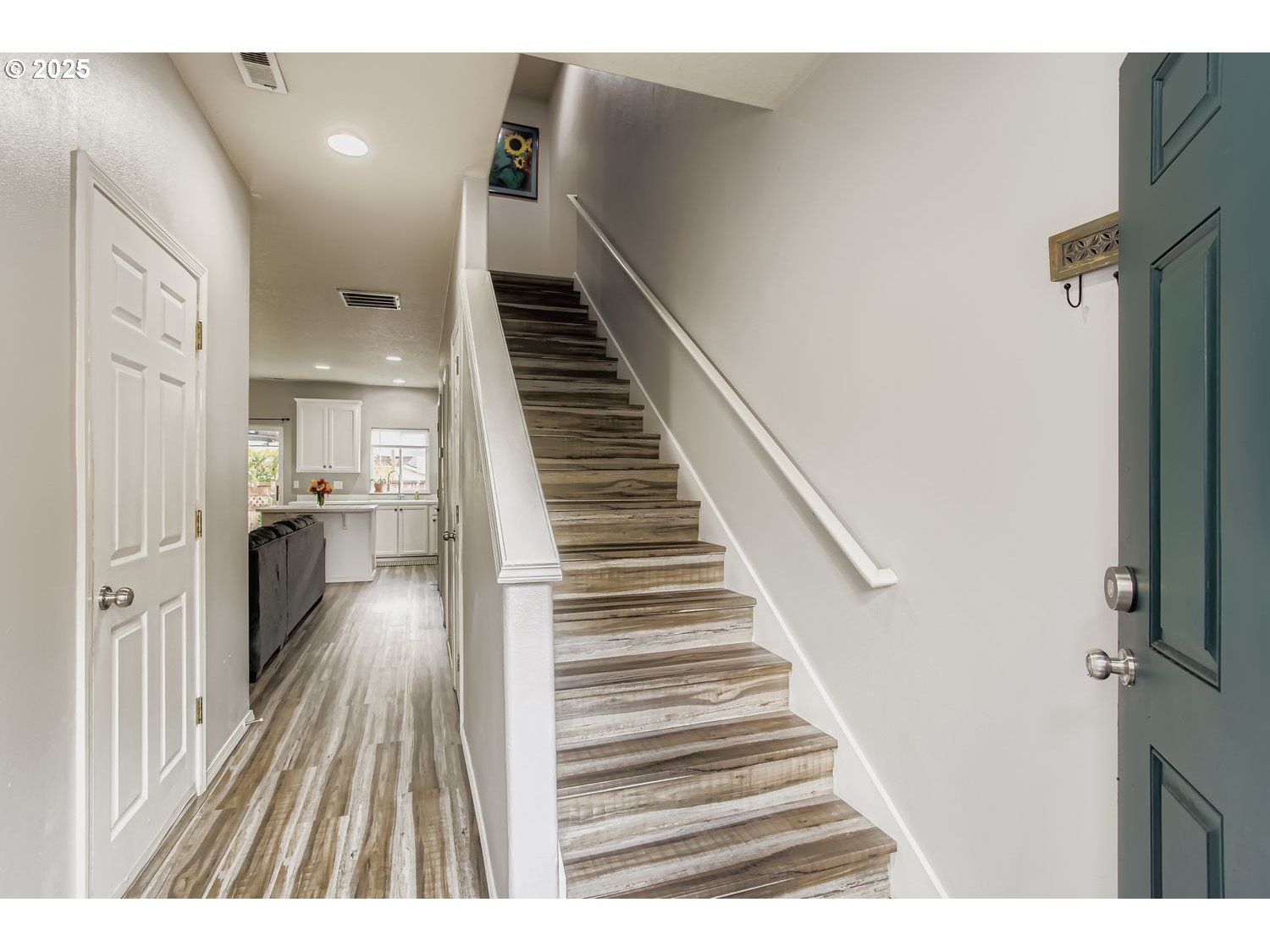 3138 Southwest 177th Place Beaverton, OR 97003 - Photo 2 of 28 a view of entryway and hall with wooden floor