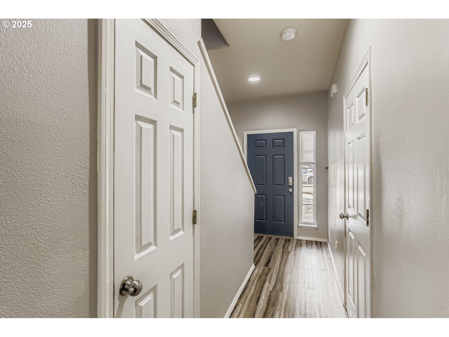 3138 Southwest 177th Place Beaverton, OR 97003 - Photo 3 of 28 a view of a hallway with wooden floor and staircase