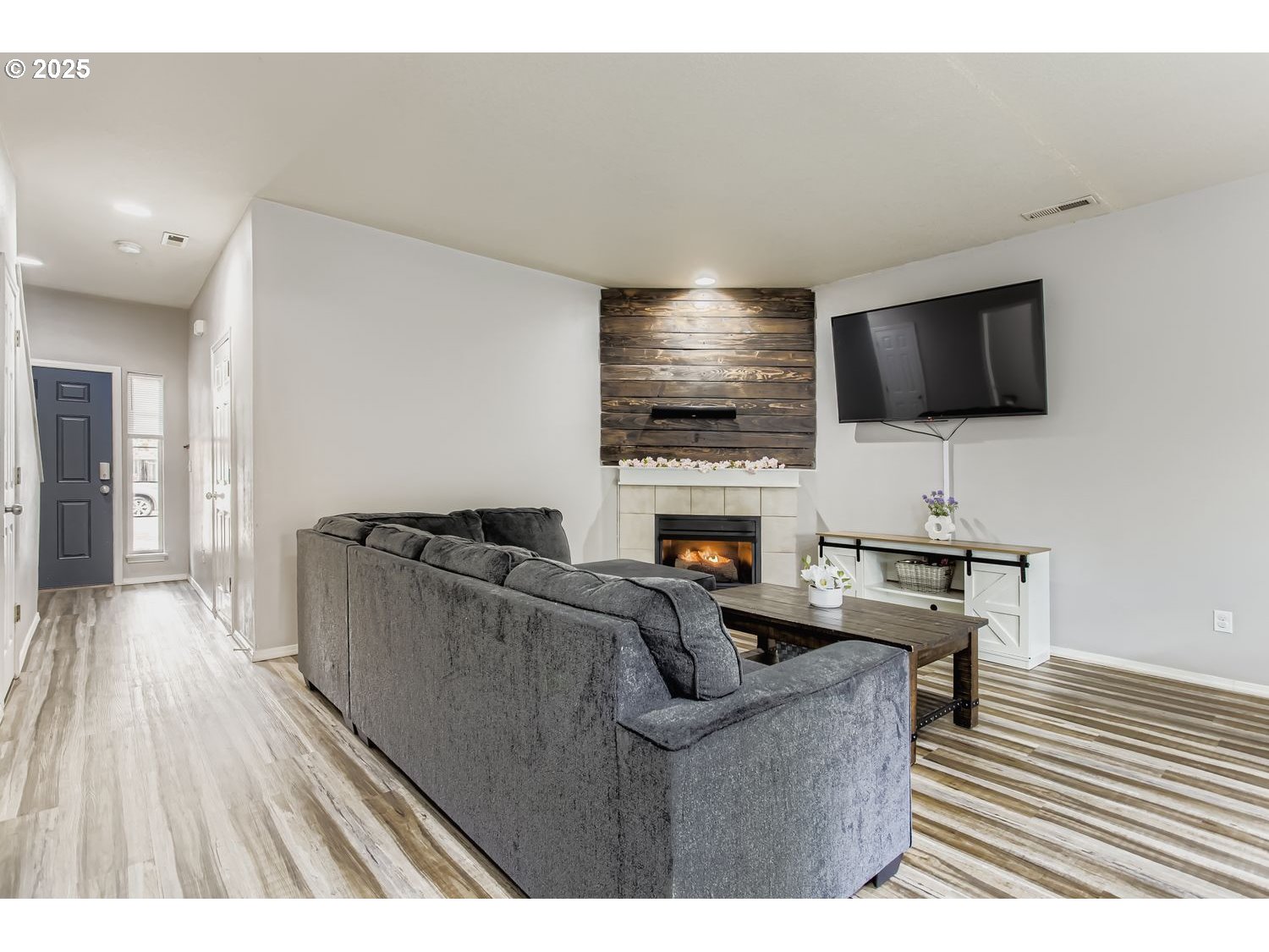 3138 Southwest 177th Place Beaverton, OR 97003 - Photo 4 of 28 a living room with furniture and a flat screen tv