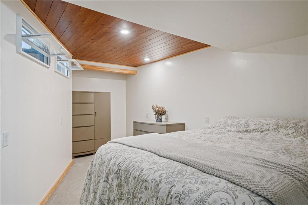 905 Indian Creek Valley Road Normalville, PA 15469 - Photo 23 of 38 a bedroom with a bed and a cabinets