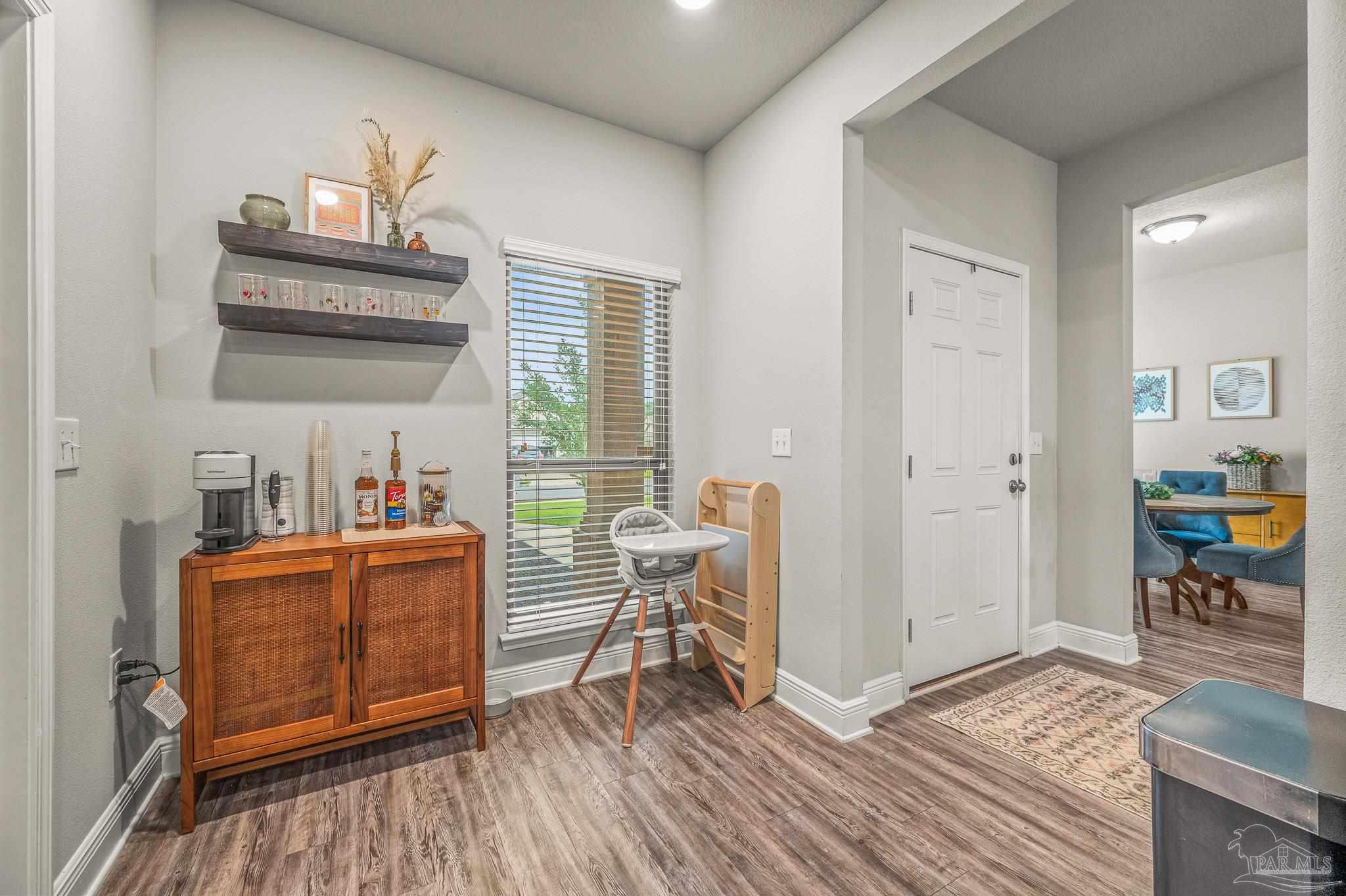 5329 Talon Road Pace, FL 32571 - Photo 14 of 45 a living room with furniture and a wooden floor