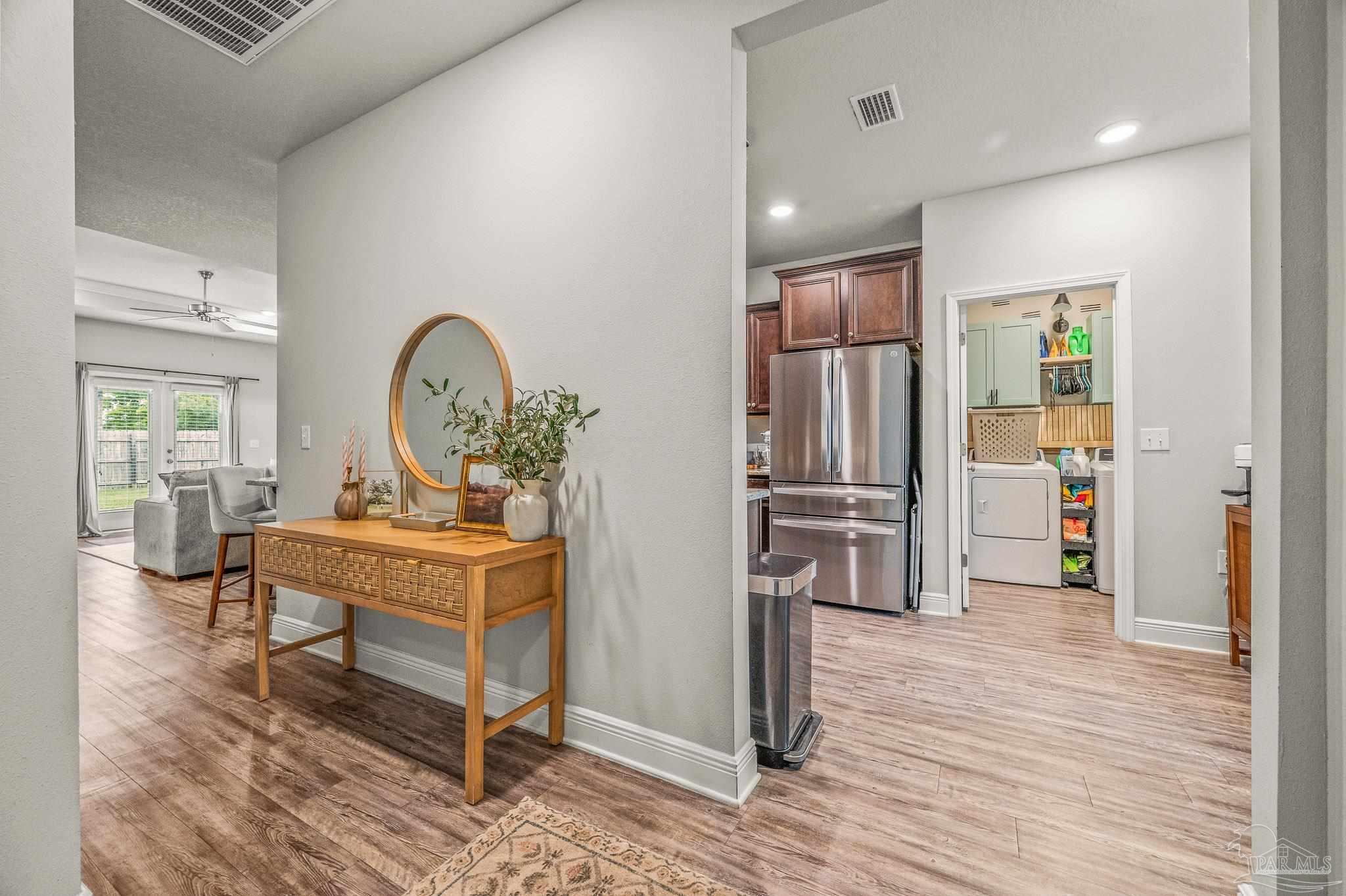 5329 Talon Road Pace, FL 32571 - Photo 15 of 45 a view of living room filled with furniture and wooden floor