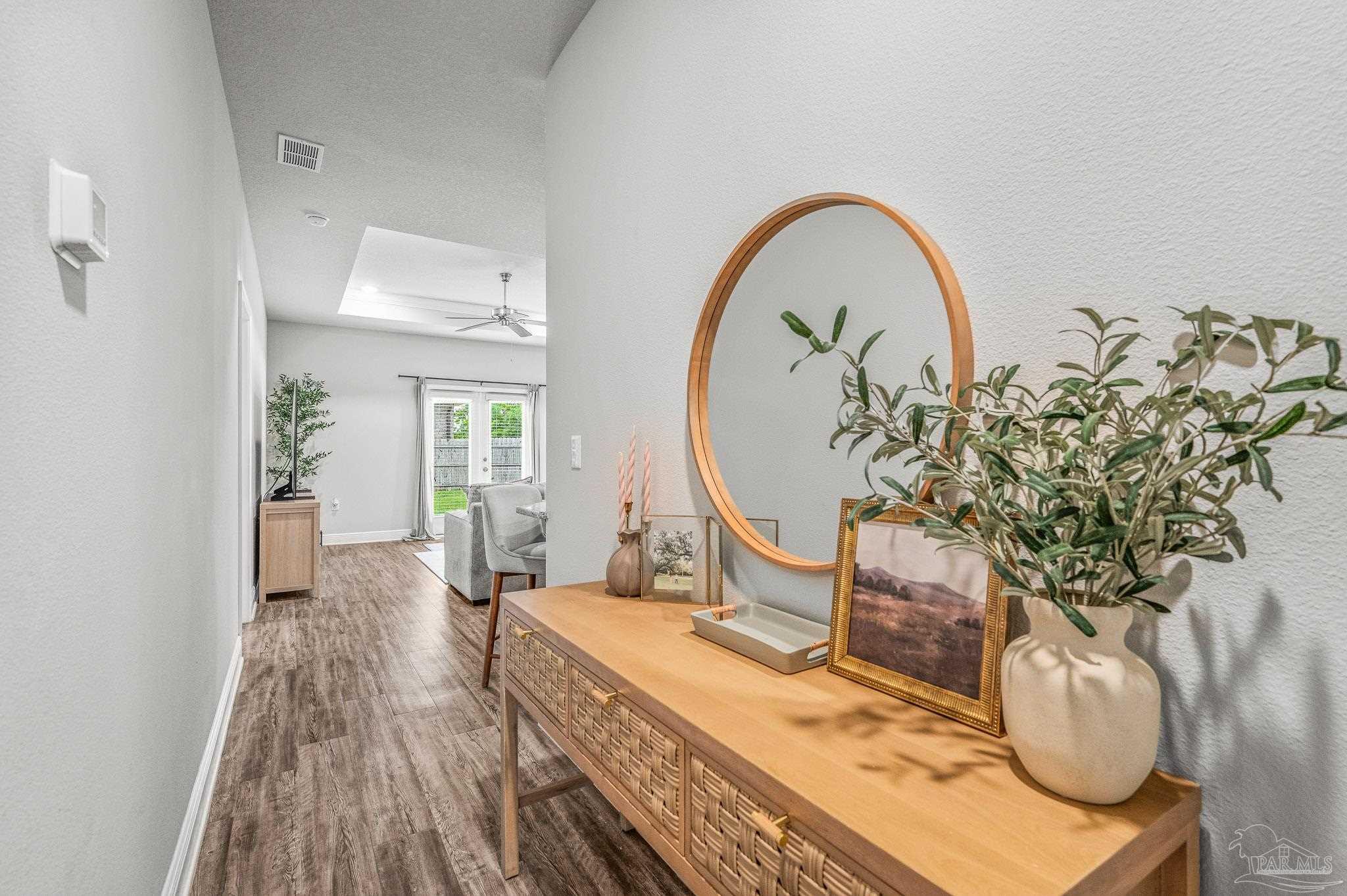 5329 Talon Road Pace, FL 32571 - Photo 16 of 45 a living room with furniture and a potted plant