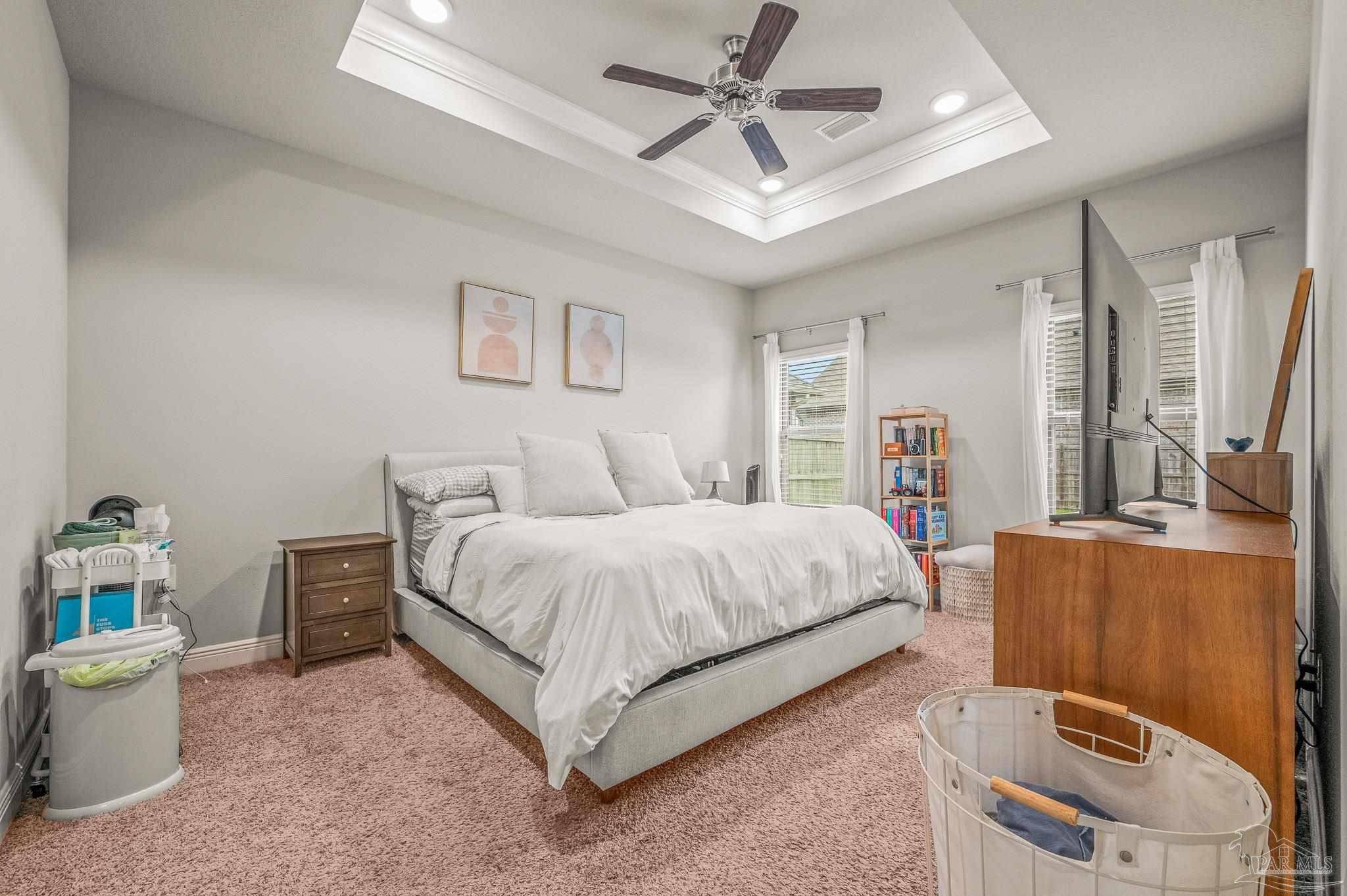 5329 Talon Road Pace, FL 32571 - Photo 23 of 45 a bedroom with a bed and a chandelier