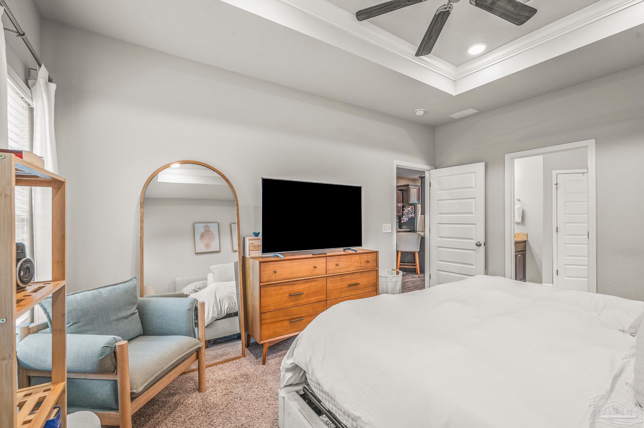 5329 Talon Road Pace, FL 32571 - Photo 25 of 45 a bedroom with a bed and a flat screen tv