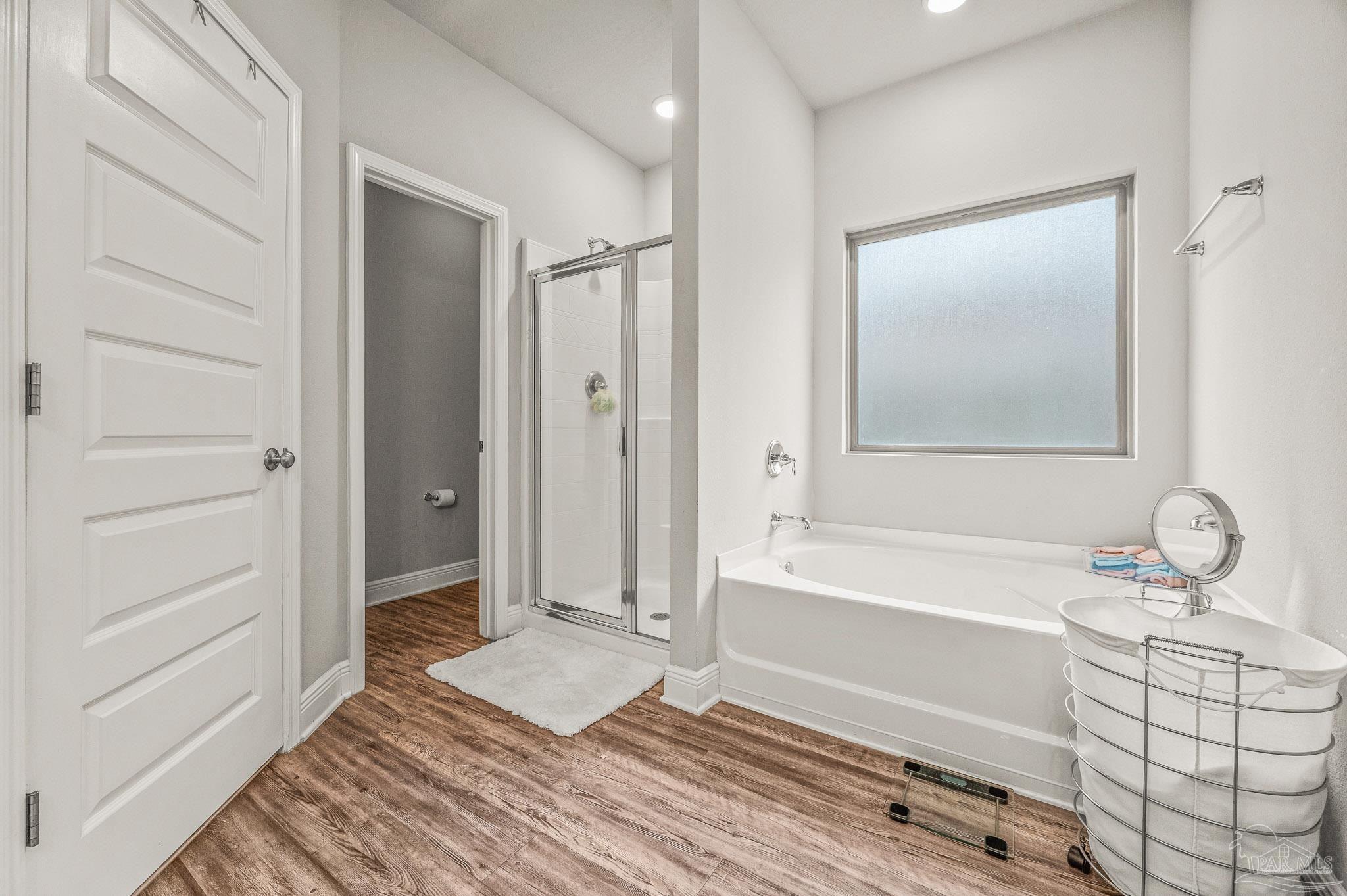 5329 Talon Road Pace, FL 32571 - Photo 27 of 45 a bathroom with a tub a sink and a shower