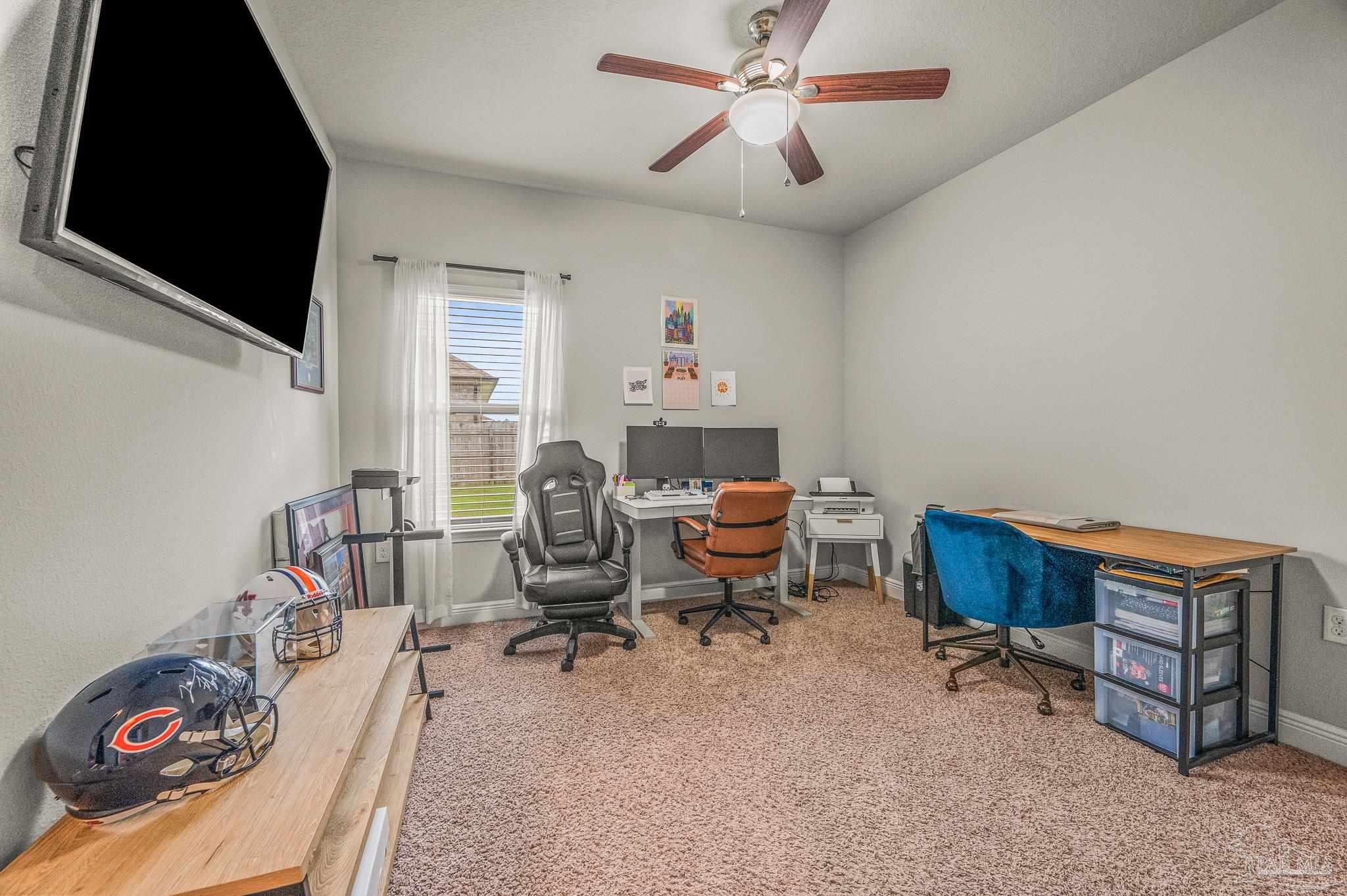 5329 Talon Road Pace, FL 32571 - Photo 37 of 45 a living room with furniture and a flat screen tv