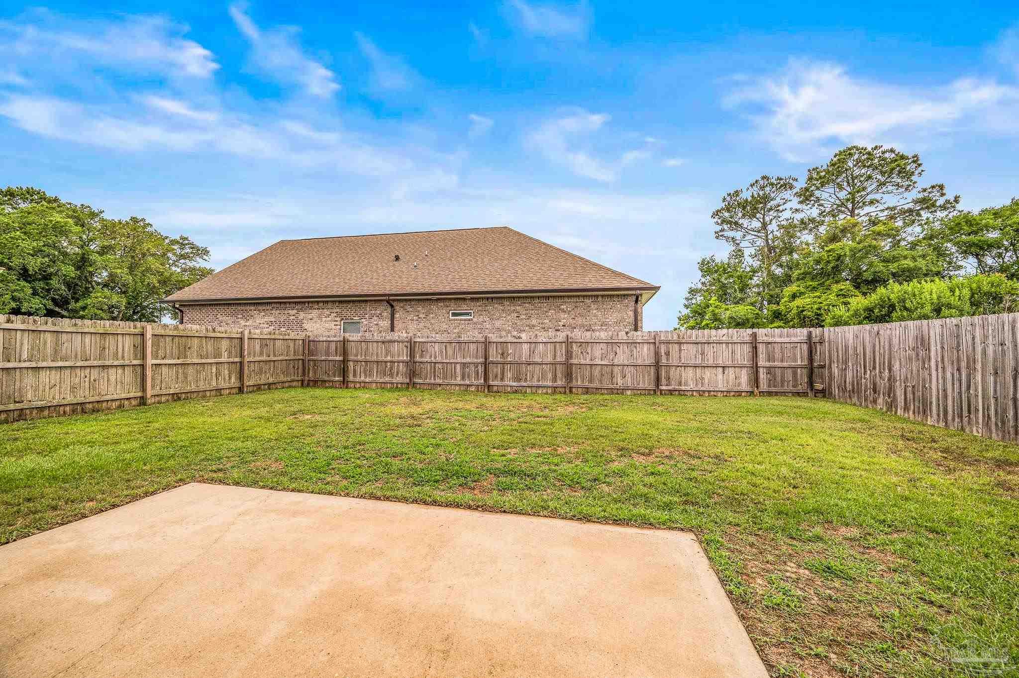 5329 Talon Road Pace, FL 32571 - Photo 41 of 45 a view of a house with a backyard