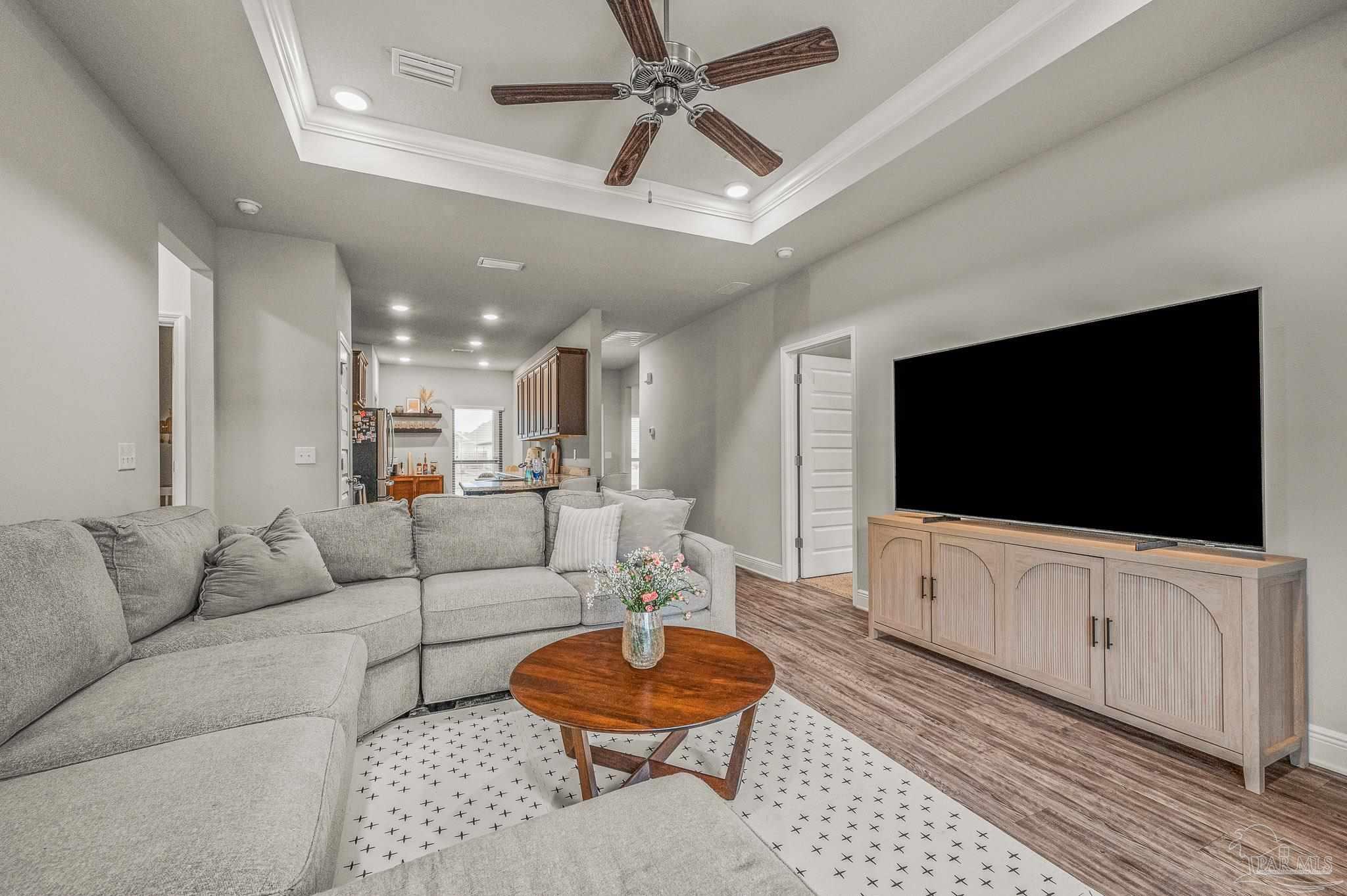 5329 Talon Road Pace, FL 32571 - Photo 5 of 45 a living room with furniture and a flat screen tv