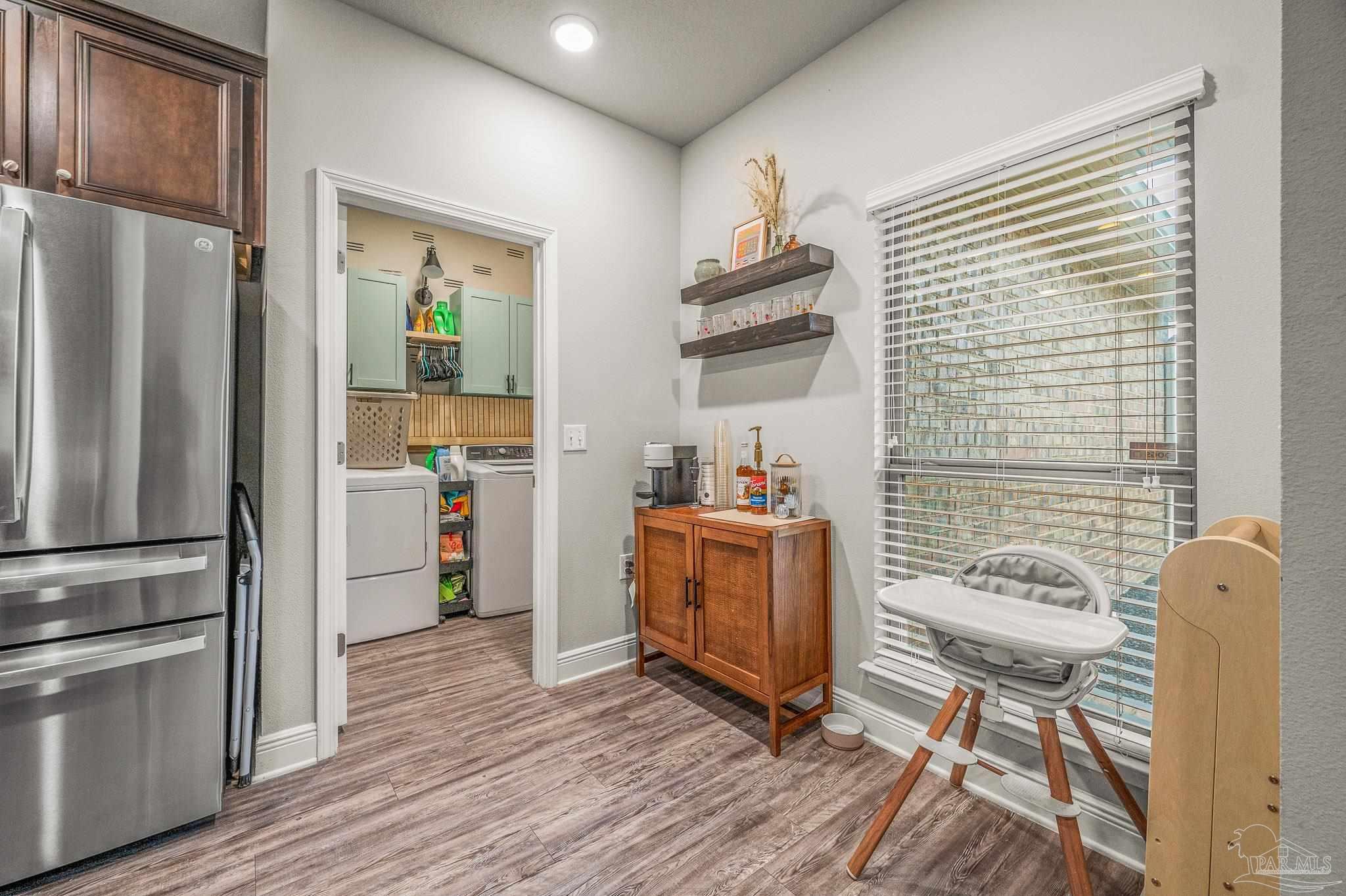 5329 Talon Road Pace, FL 32571 - Photo 9 of 45 a kitchen with a refrigerator and a stove top oven