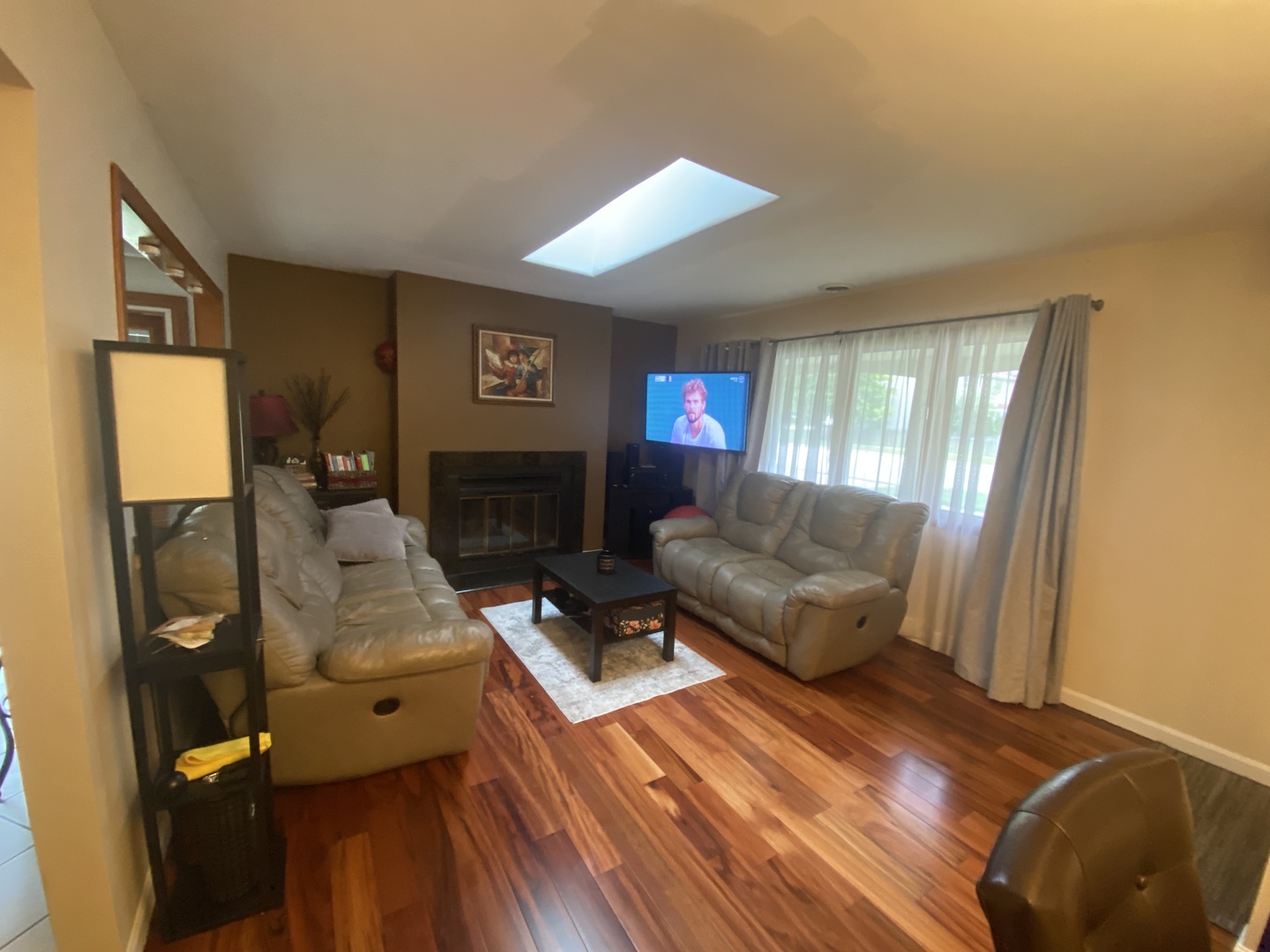 1748 Brookdale Road Naperville, IL 60563 - Photo 11 of 28 a living room with furniture and a fireplace