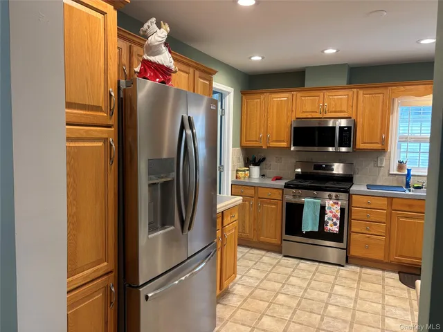 a view of a hallway with paintings on the wall