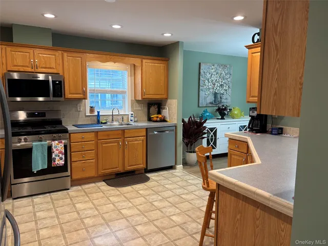 a view of a backyard with a large tree