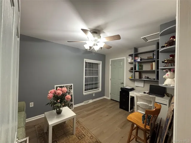 a view of a book shelf in front of a house
