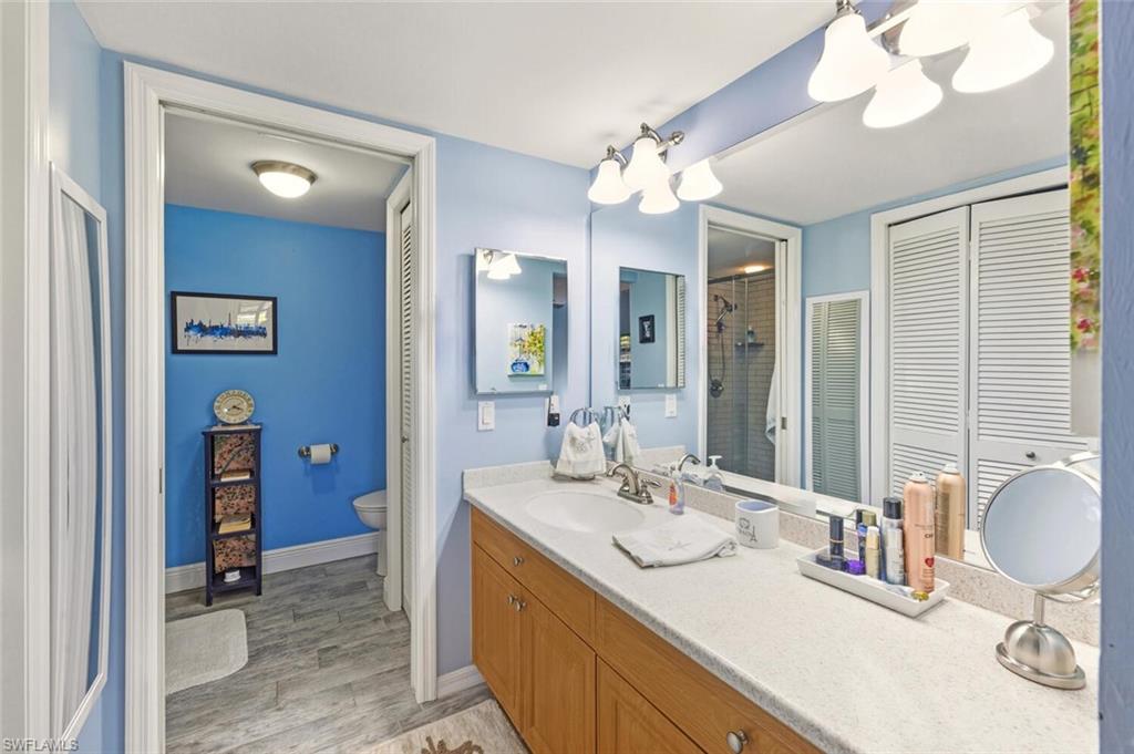 7380 St Ives Way, Unit 1108 Naples, FL 34104 - Photo 15 of 46 PRIMARY BATH CORIAN COUNTERTOP