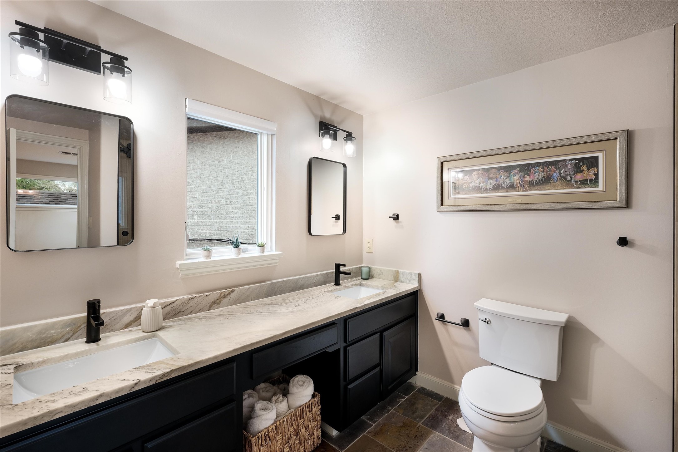 1807 Terminal Loop Road McQueeney, TX 78123 - Photo 18 of 33 a bathroom with a granite countertop toilet sink and mirror
