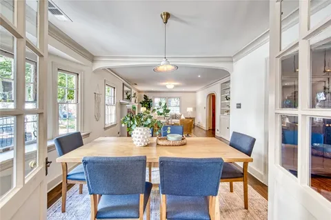 a view of a dining room with furniture window and outside view