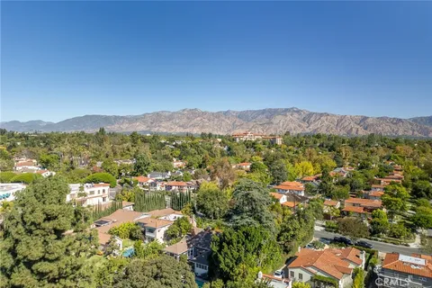 a view of a city with a mountain in the background