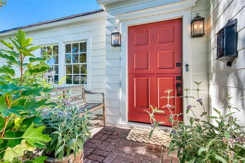 a bench sitting in front of a house