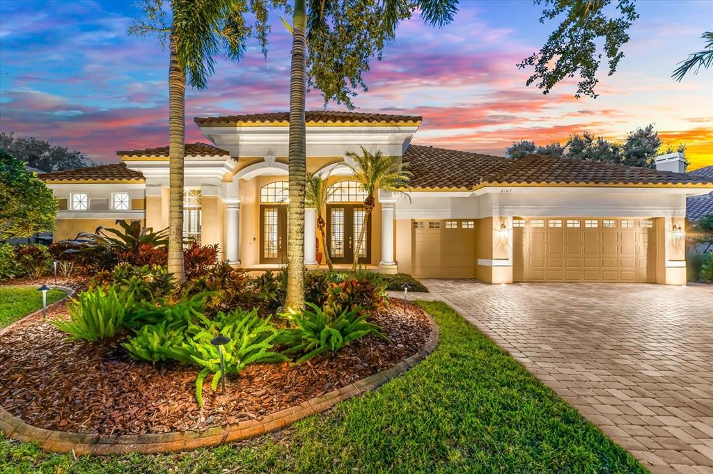 2107 Pinnacle Circle South Palm Harbor, FL 34684 - Photo 1 of 1 a view of a house with a yard and potted plants