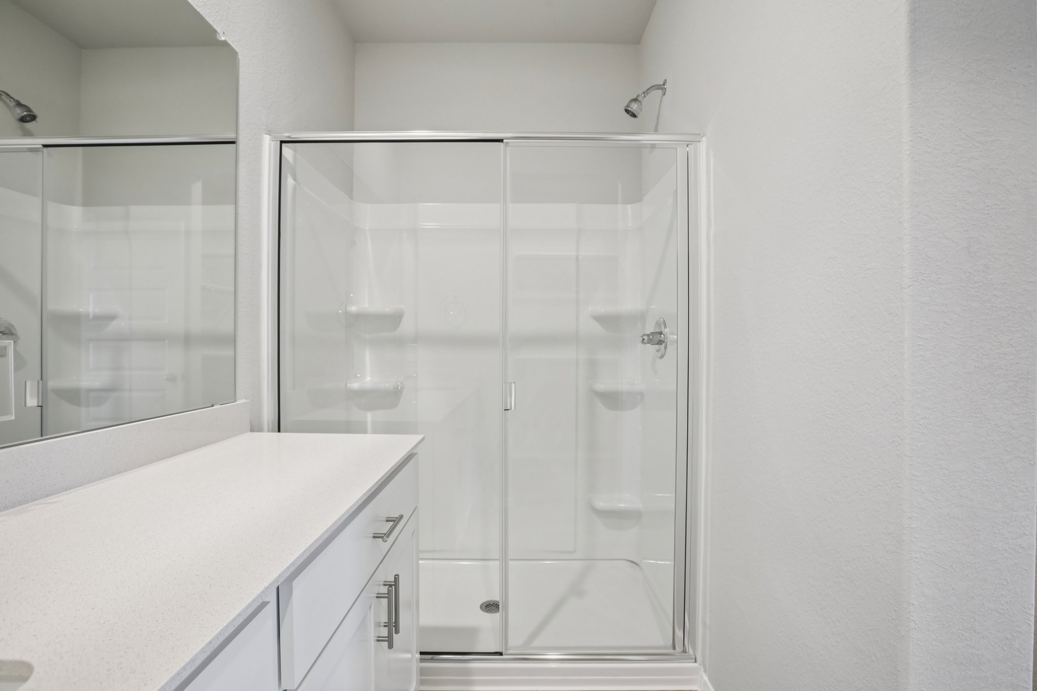 104 Summer Drive Elgin, TX 78621 - Photo 22 of 40 a bathroom with a shower and a sink