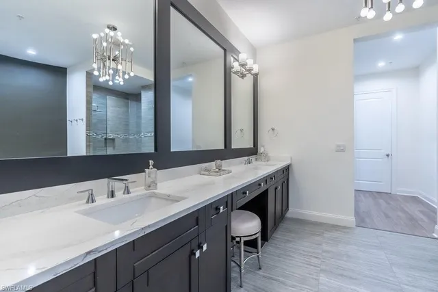 a bathroom with a sink double vanity and a mirror