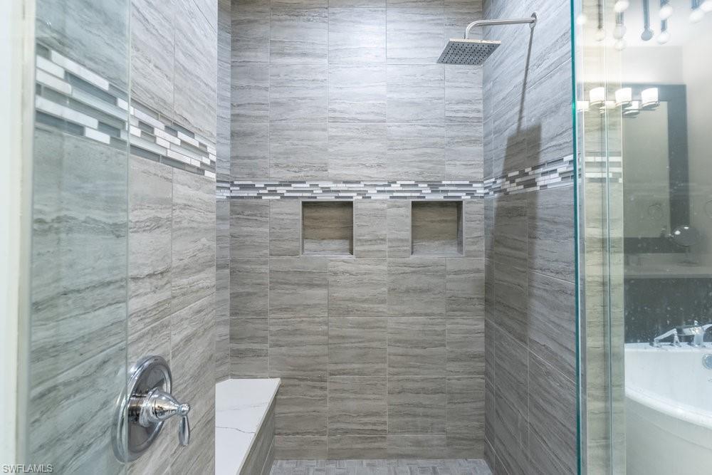 16394 Corsica Way, Unit 101 Naples, FL 34110 - Photo 19 of 43 a bathroom with a shower