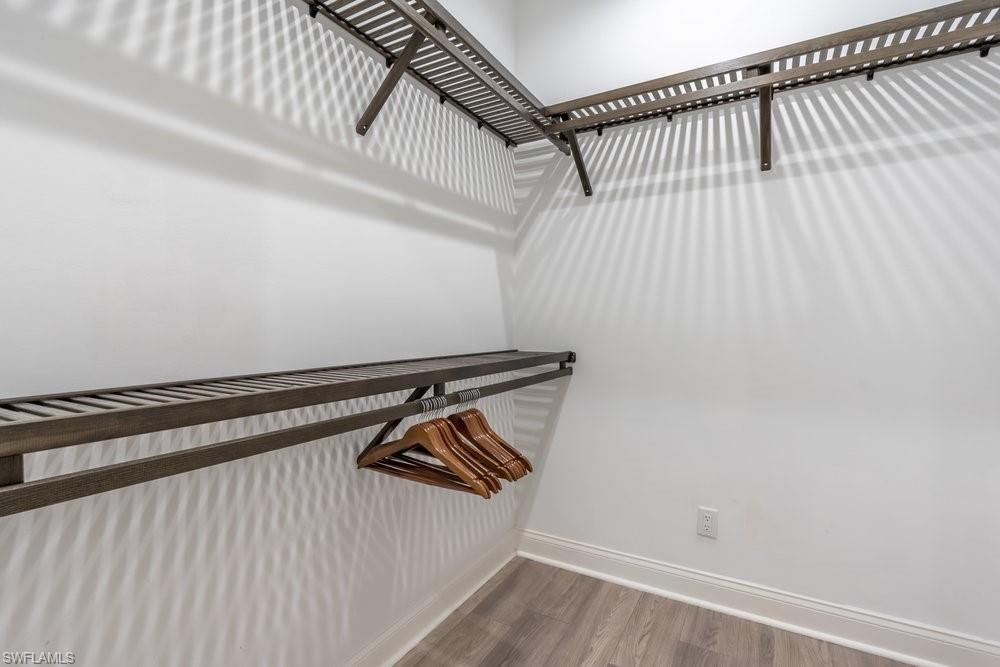 16394 Corsica Way, Unit 101 Naples, FL 34110 - Photo 20 of 43 a view of a room with racks on the wall